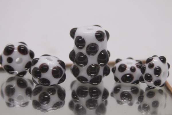 Textured Black Dots on a White Base on a 22" cord and matching earrings