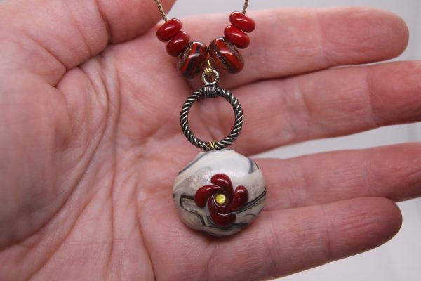 Green and Ivory with a Red Flower