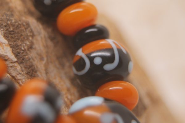 Black and Apricot Half-n-half with Sky Blue on a 20" chain and matching earrings