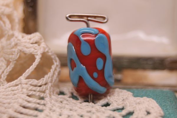 A Focal Bead: Reddish Orange with Light Turquoise on a 26" cord
