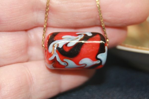 A Focal Bead of Red, Sky Blue and Black