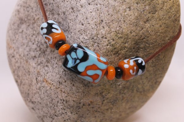 Black and Apricot Half-n-half with Sky Blue on a 24" cord