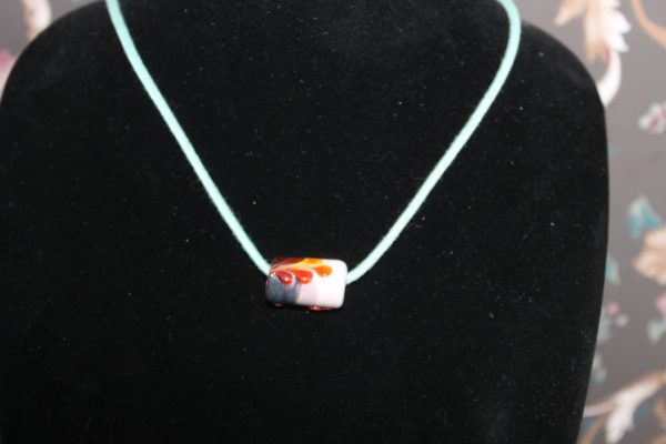 A Focal Bead of Pinks with a Splash of Red on a 26" cord