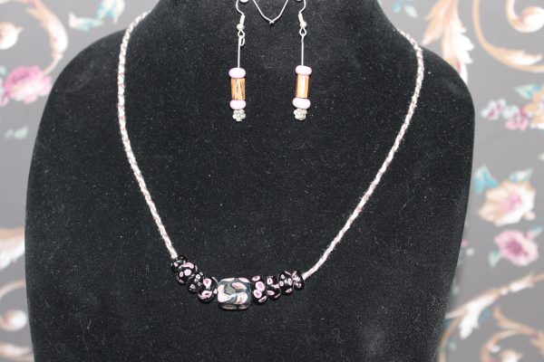 Black with Purple Puckers on a 26" cord with matching earrings
