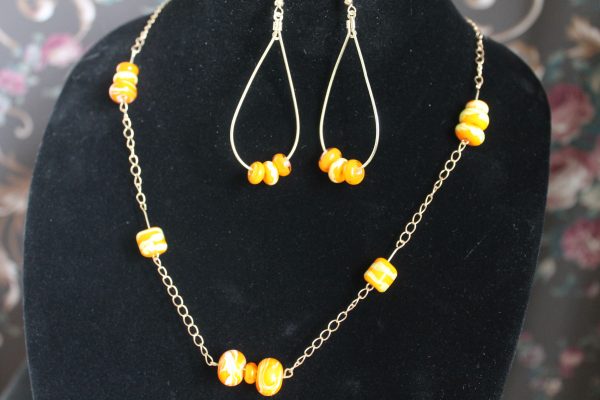 Orange/White and Orange/Yellow on a 24" chain with matching earrings